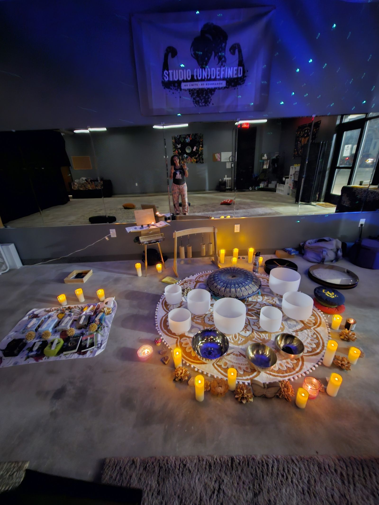 Singing bowls circled by candlelight