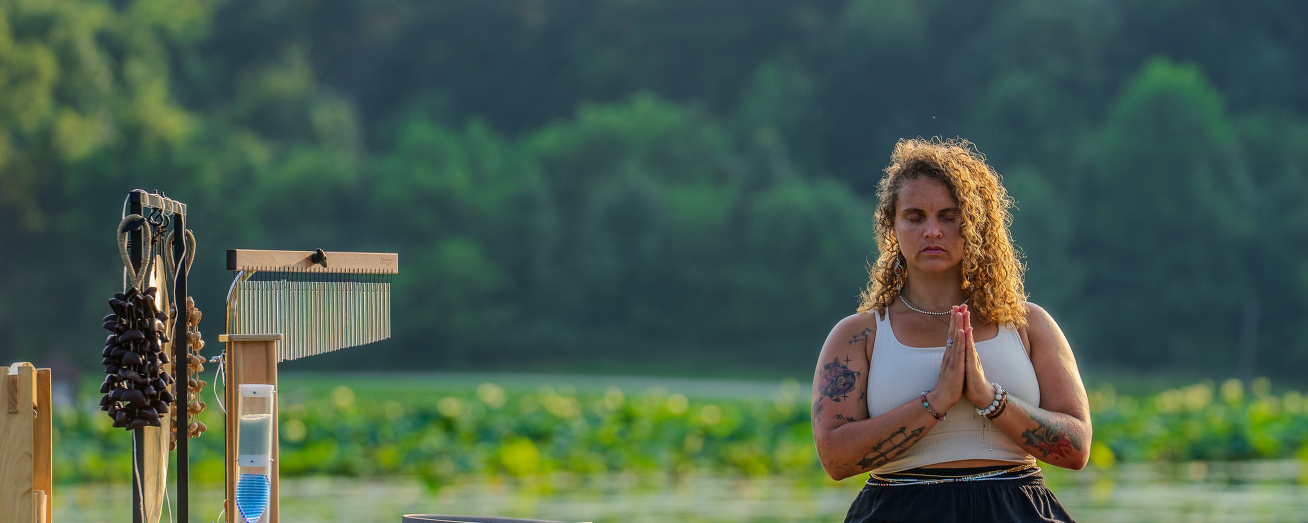 A sound journey on the lake at golden hour, bowls set out on the water